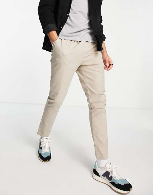 ASOS DESIGN – Eng geschnittene Chinohose in Beige mit elastischem Bund