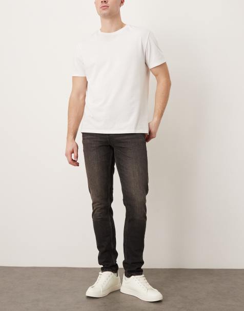 ASOS DESIGN – Eng geschnittene Jeans in verwaschenem Schwarz mit braunem Farbstich - view 1