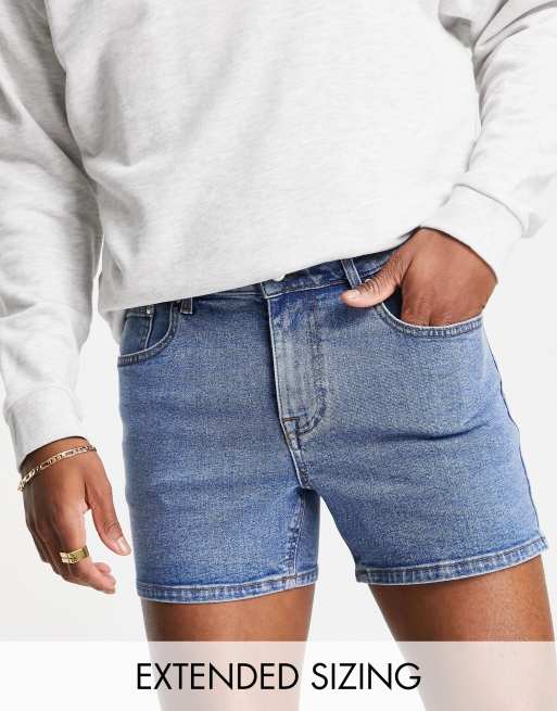 ASOS DESIGN – Eng geschnittene Jeansshorts zum Überziehen in dunkelblauer Waschung, kurze Länge 