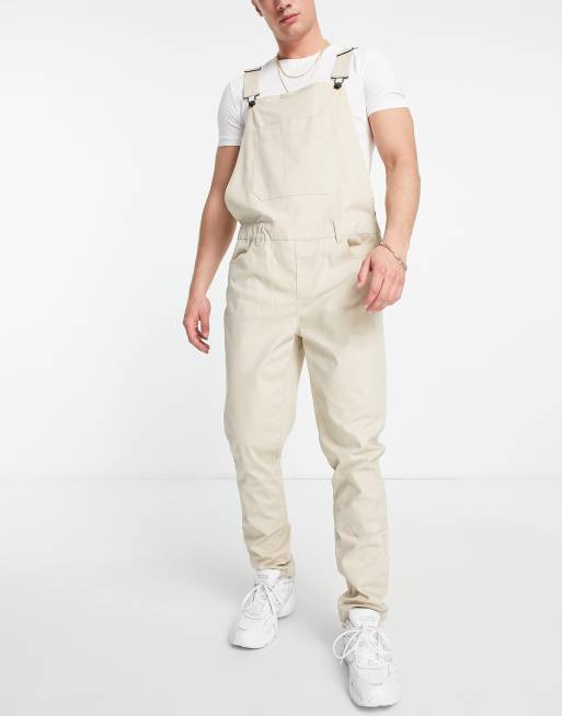 ASOS DESIGN – Eng geschnittene Latzhose in Stein
