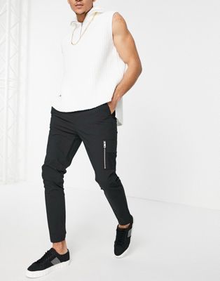 ASOS DESIGN – Enge Hose aus Nylon mit elastischer Taille und MA1-Tasche in Schwarz