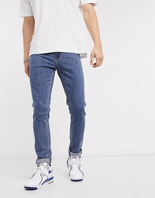 ASOS DESIGN – Enge Jeans in Mittelblau
