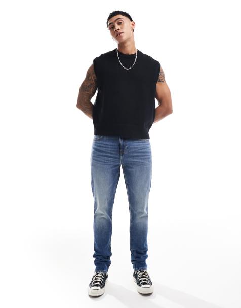 ASOS DESIGN – Enge Jeans in verwaschenem Mittelblau - view 1