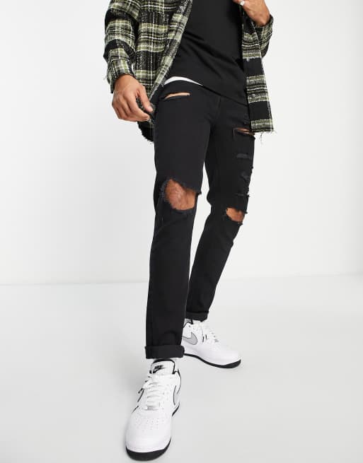 ASOS DESIGN – Enge Jeans in verwaschenem Schwarz mit starken Rissen