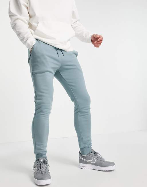 ASOS DESIGN – Enge Jogginghose in Grau