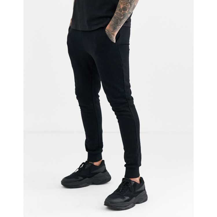 ASOS DESIGN Enge Jogginghose in Schwarz BLACK