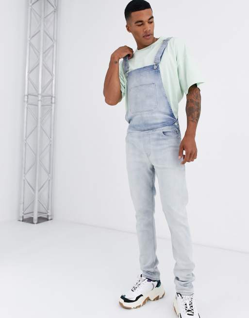 ASOS DESIGN – Enge Latzhose aus Denim in verwaschenem Hellbau