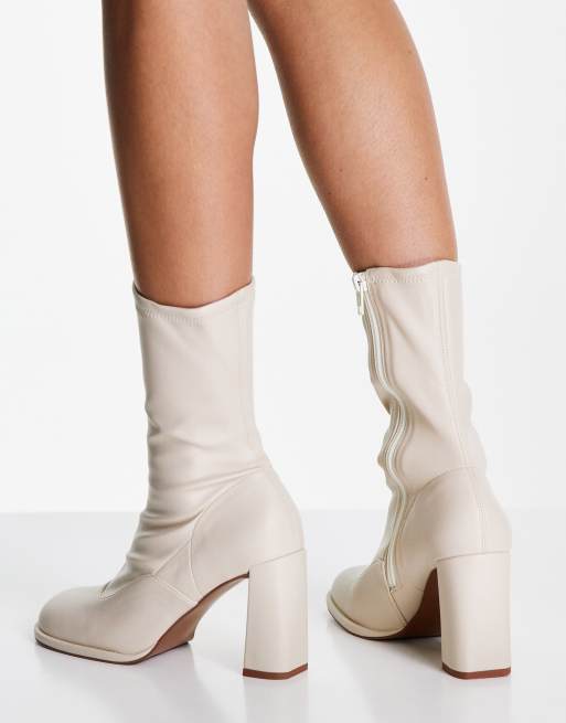 Cream store patent boots