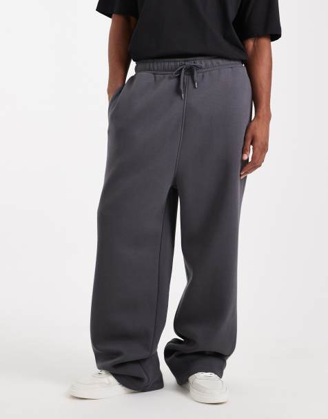 ASOS DESIGN - Essential - Joggingbroek met wijde pijpen in zwart met wassing - view 1