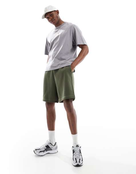 ASOS DESIGN essential mid length oversized shorts in dark green - view 1