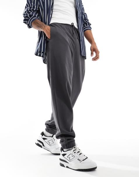 ASOS DESIGN – Essential – Mörkgrå mjukisbyxor i oversize - view 1