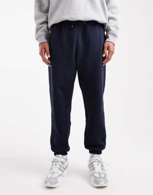 Asos Design Essential Tapered Sweatpants In Blue