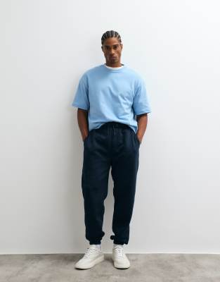Asos Design Essential Tapered Sweatpants In Blue