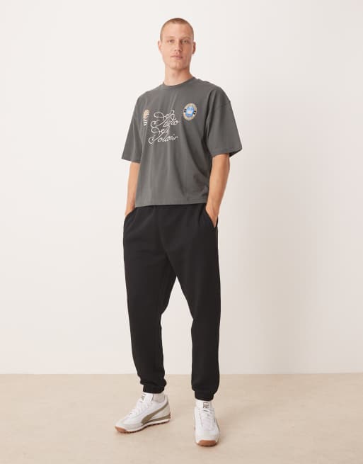 ASOS DESIGN Essential tapered trackies in black 