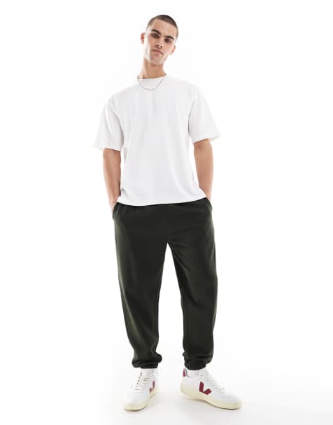 ASOS DESIGN – Essential – Zwężane ciemnozielone joggersy - view 1