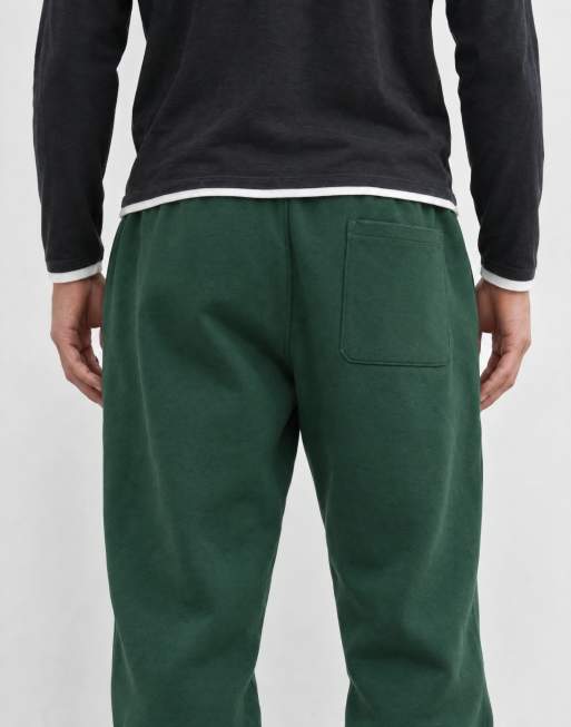 ASOS DESIGN essentials joggingbroek met boorden in donkergroen, 7 van 9