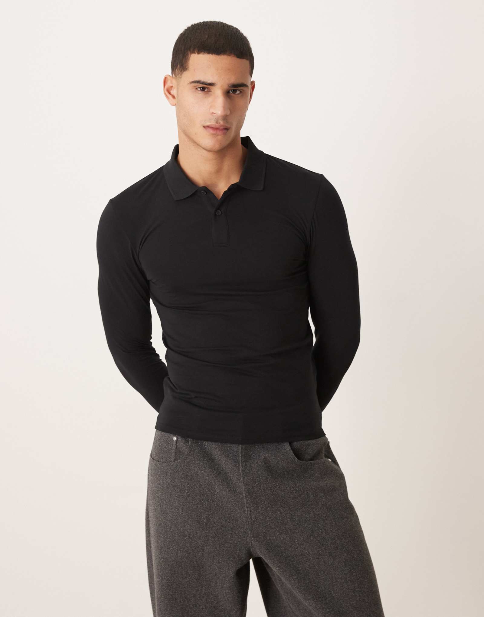 Черное поло с длинным рукавом в обтяжку от ASOS DESIGN Essentials черного цвета