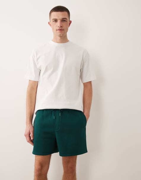 ASOS DESIGN essentials oversized fit jersey shorts in dark green - view 1