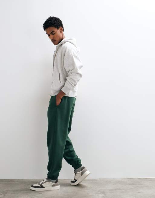ASOS DESIGN essentials oversized jogger in dark green, 5 of 5