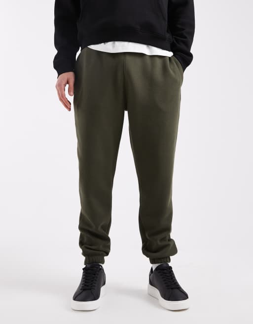 ASOS DESIGN essentials tapered trackies in green , 2 of 5
