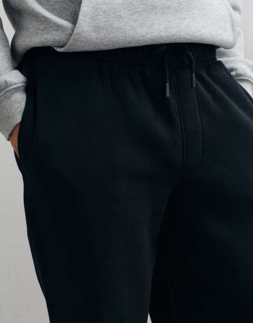 ASOS DESIGN Essentials weiter Jogger in Schwarz, 2 von 5
