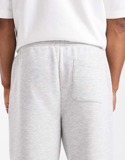 ASOS DESIGN – Essentials – Vitmelerade mjukisbyxor med vida ben