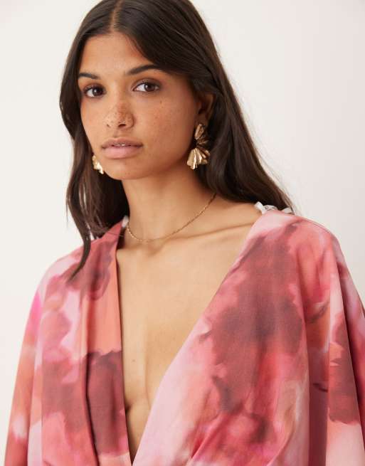 ASOS DESIGN exaggerated sleeve plunge romper in soft floral print