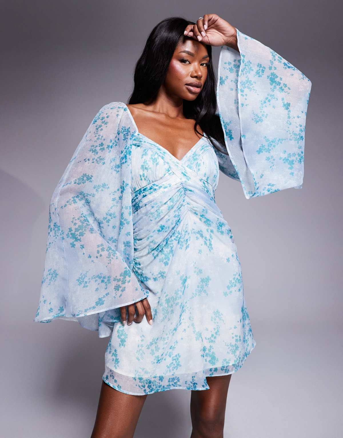 ASOS DESIGN exaggerated sleeve ruched mini dress in blue floral print