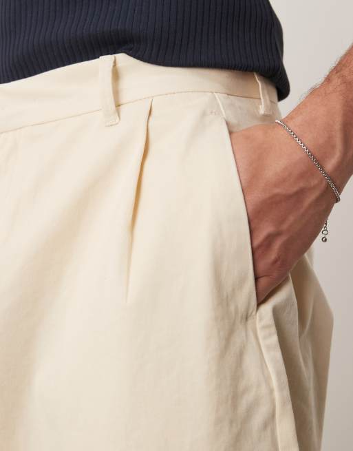 ASOS DESIGN – Extrem schmal zulaufende Hose in Beige mit Bundfalten, 3 von 5