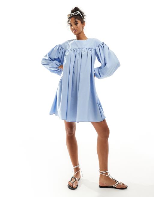 ASOS DESIGN extreme gathered smock mini dress with exaggerated sleeve and  bow back in blue | ASOS