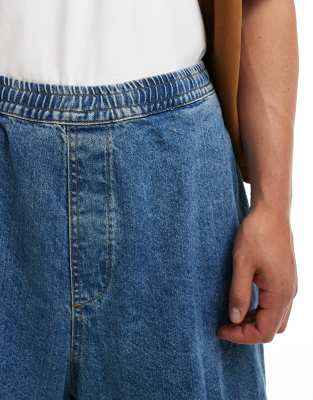 ASOS DESIGN extreme oversized parachute jeans with tuck details in blue wash 