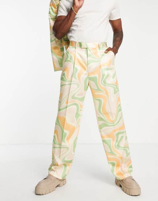 ASOS DESIGN extreme wide suit pants in sage green and orange swirl print