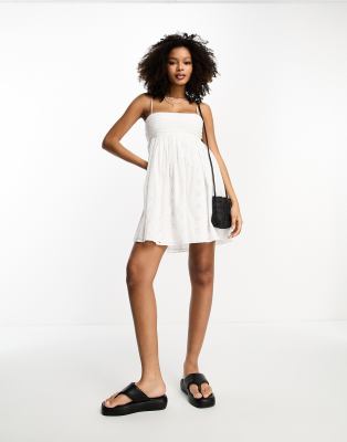 ASOS DESIGN eyelet cotton pleat bust babydoll mini sundress in white | ASOS