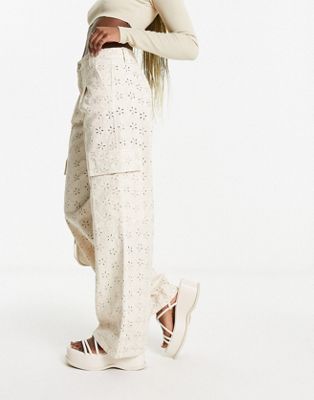 TENACITY : Wide leg pants with stud and eyelet decoration