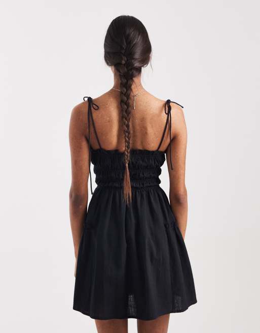 ASOS DESIGN – Faith – Gesmoktes Sommerstrandkleid in Minilänge in Schwarz , 3 von 4