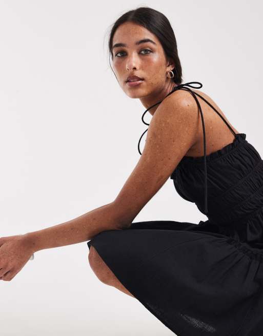 ASOS DESIGN – Faith – Gesmoktes Sommerstrandkleid in Minilänge in Schwarz , 4 von 4