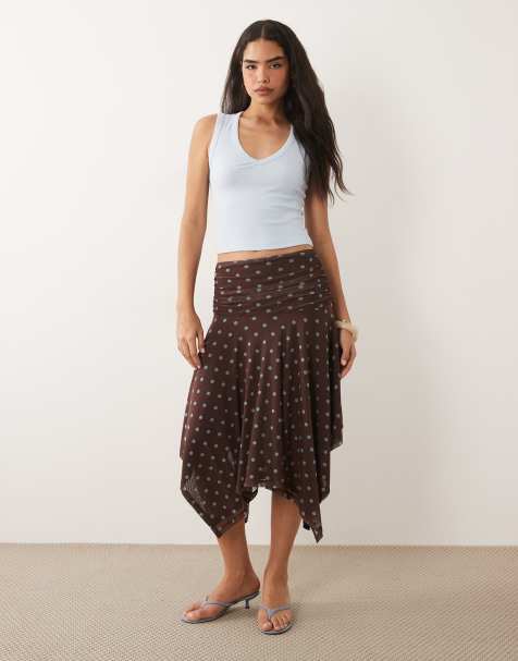 ASOS DESIGN - Falda marrón con estampado de lunares y bajo asimétrico de malla transparente - view 1
