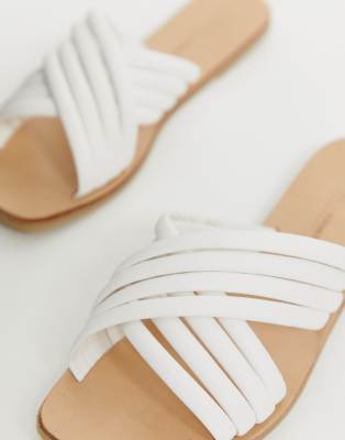 white cross flat sandals