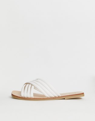 white cross flat sandals