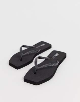 black plastic flip flops