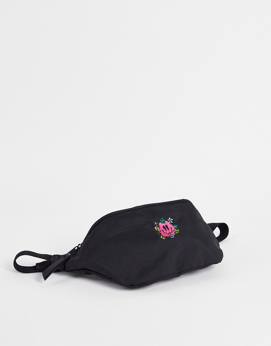 ASOS DESIGN fanny pack in black nylon with smile embroidery