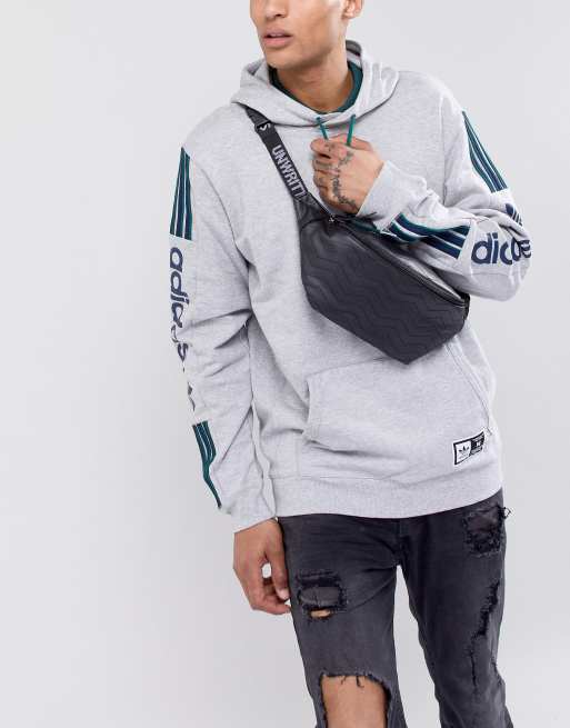 ASOS DESIGN fanny pack in faux leather with zig zag stitch and slogan