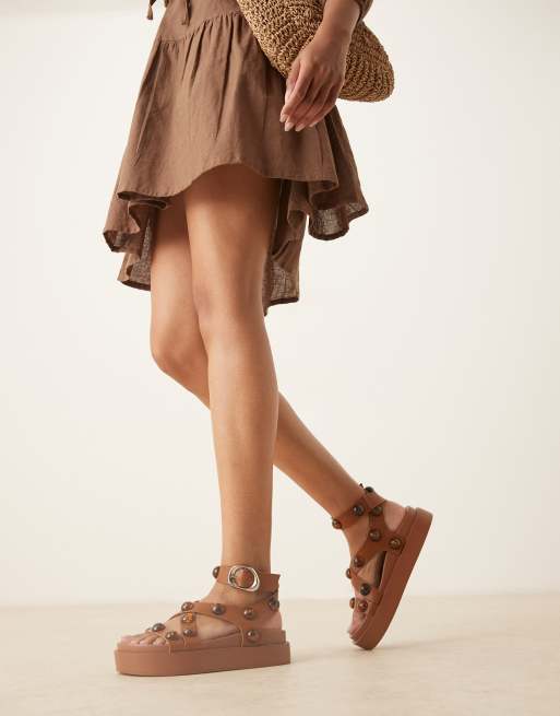 ASOS DESIGN Farrah cross strap footbed sandals with tortoise shell beads in tan