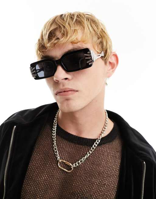 ASOS DESIGN fashion glasses with skeleton hand detail in black