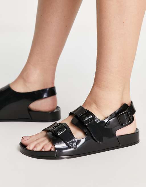 ASOS DESIGN Fate jelly flat sandals with buckles in black ASOS