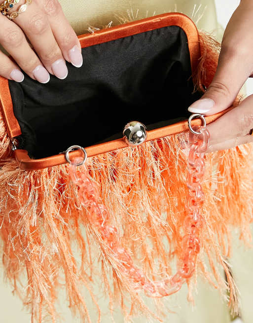 ASOS DESIGN faux feather clutch bag with resin handle in orange ASOS