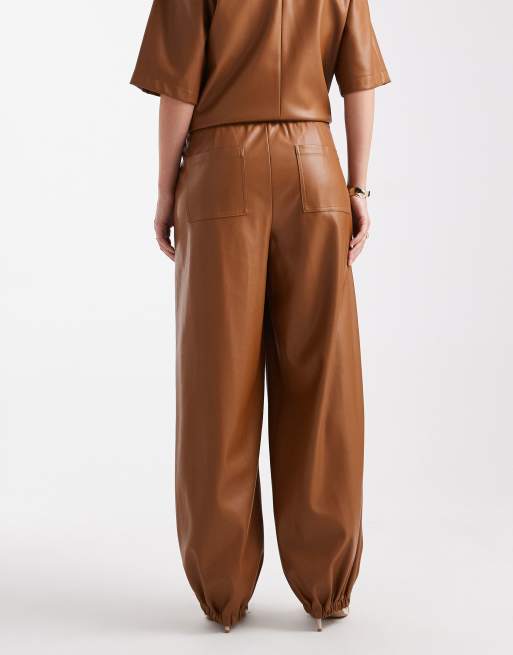 ASOS DESIGN faux leather barrel leg pull on pants in caramel - part of a set