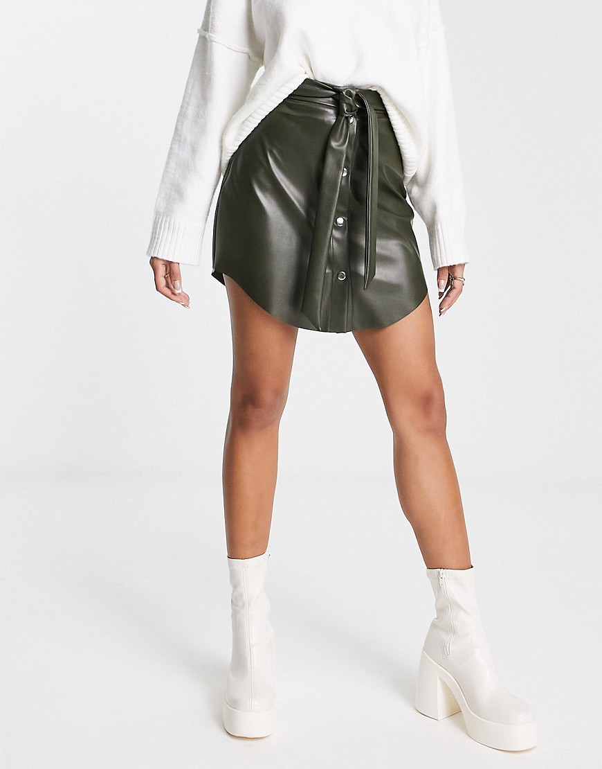 ASOS DESIGN faux leather button through mini skirt with belt in khaki-Green