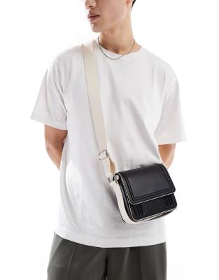 faux leather cross body bag with contrast ecru strap and piping in black
