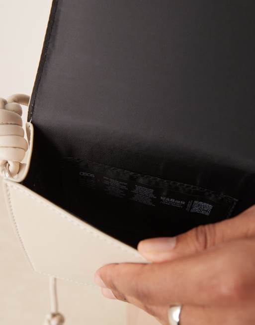 ASOS DESIGN faux leather cross body bag with strap detail in ecru, 3 of 4